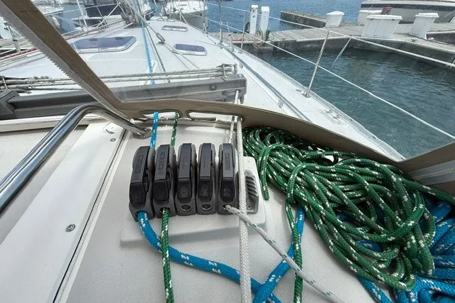 Slide: The Image of Sailboat deck of 2005 Catalina 400 with ropes and cleats in marina. - 18