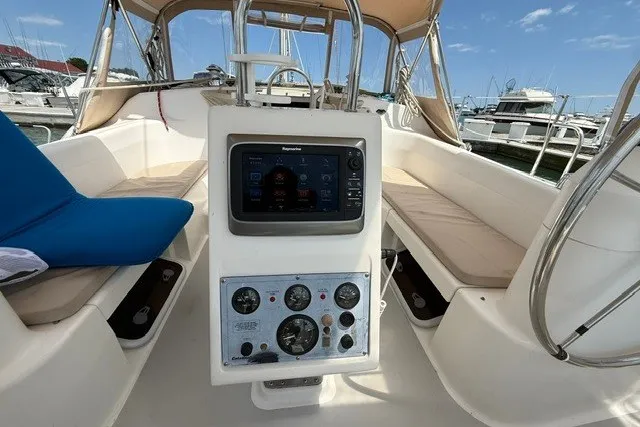 Slide: The Image of Cockpit of a 2005 Catalina 400 sailboat with navigation instruments and seating. - 26