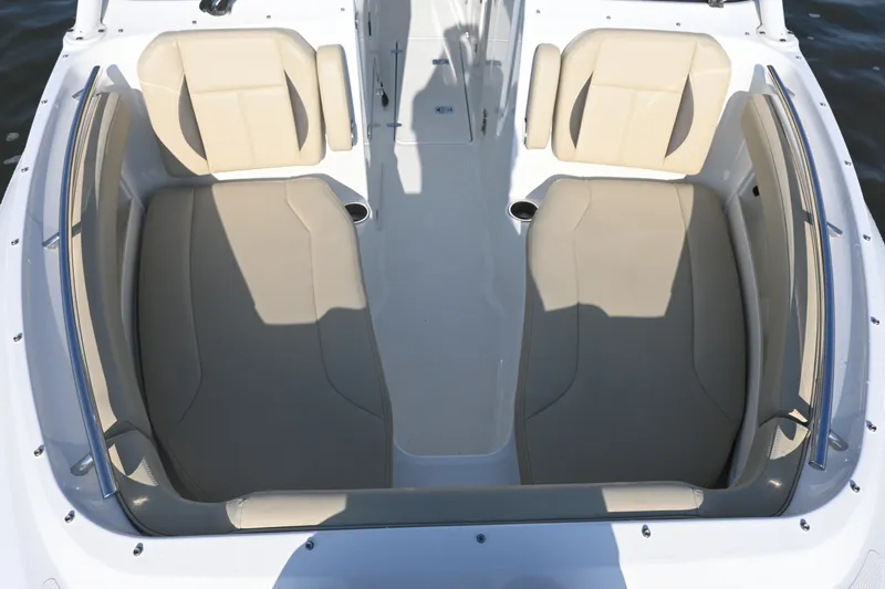 Slide: The Image of 2021 Pursuit DC 266 Dual Console boat with beige seating and sleek design. - 14