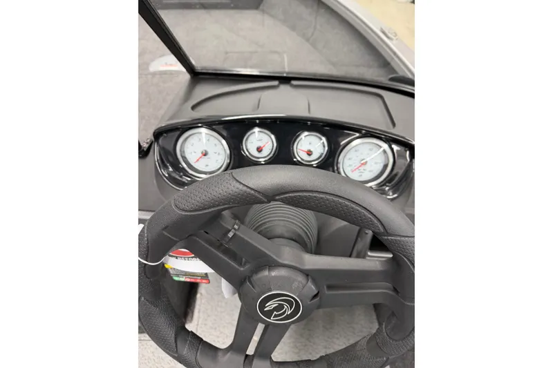 Slide: The Image of 2026 Crestliner 1750 Hawk WT dashboard with steering wheel and gauges. - 9