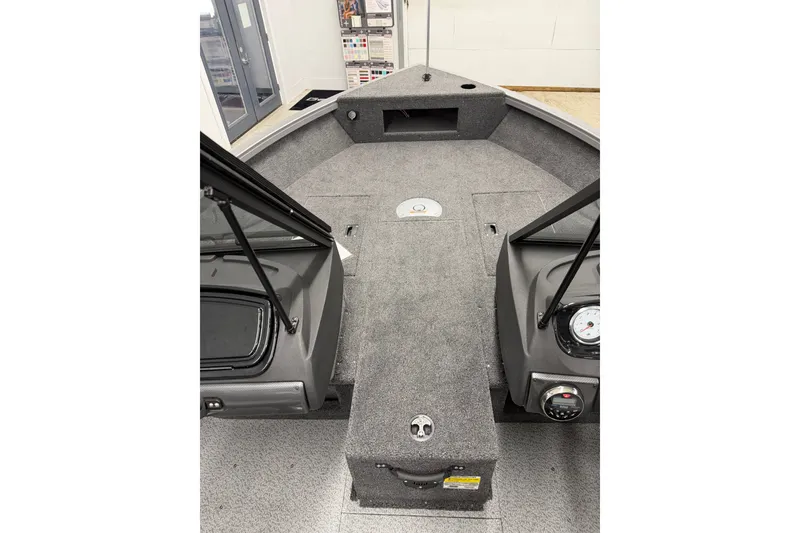 Slide: The Image of 2026 Crestliner 1750 Hawk WT boat interior with carpeted deck and control panel. - 13