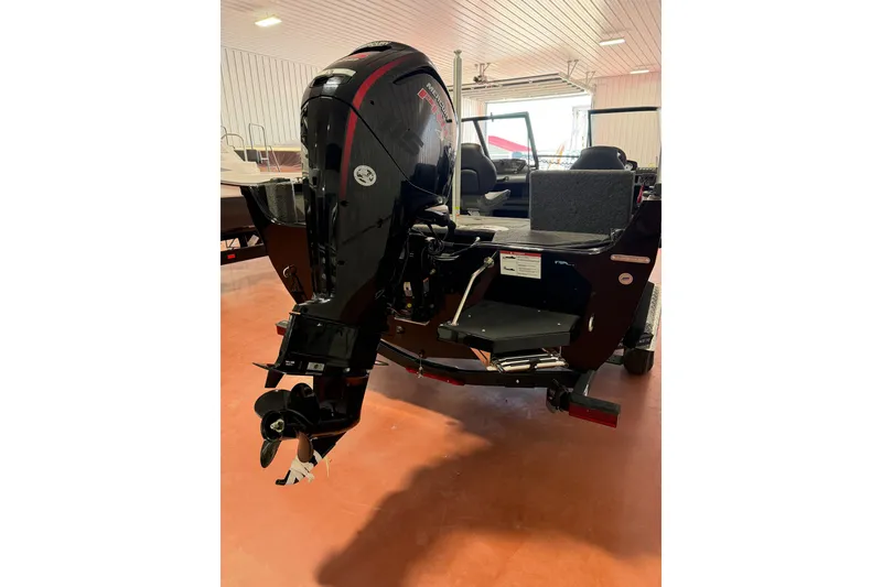 Slide: The Image of 2026 Crestliner 1750 Hawk WT boat with powerful outboard motor in showroom. - 3