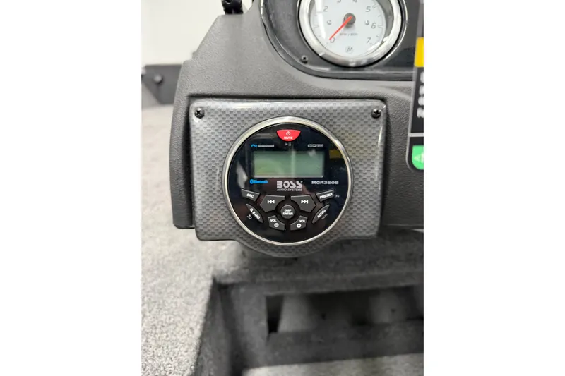Slide: The Image of Dashboard of 2026 Crestliner 1750 Hawk WT with Boss audio system and gauge. - 11