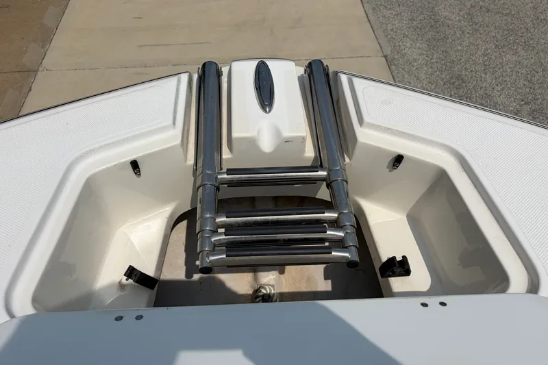 Slide: The Image of Bow view of 2012 Hurricane SunDeck Sport 220 OB with stainless steel ladder. - 24