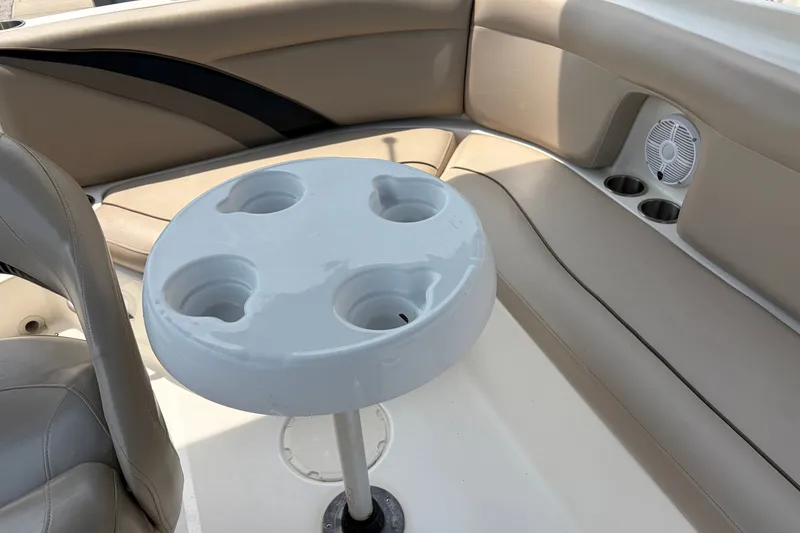 Slide: The Image of Interior of 2012 Hurricane SunDeck Sport 220 OB with cup holders and seating. - 41