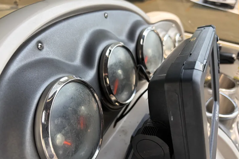 Slide: The Image of Dashboard of a 2012 Hurricane SunDeck Sport 220 OB boat with gauges and controls. - 37