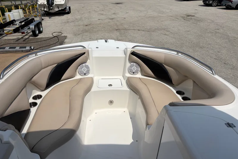 Slide: The Image of 2012 Hurricane SunDeck Sport 220 OB boat interior with beige seating and cup holders. - 22