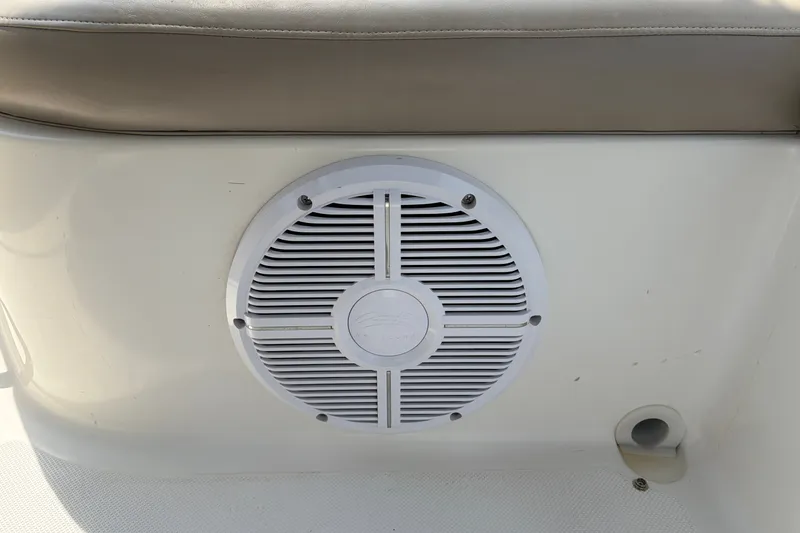 Slide: The Image of Speaker on 2012 Hurricane SunDeck Sport 220 OB boat, white panel with gray cushion. - 39