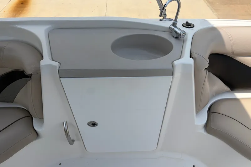 Slide: The Image of 2012 Hurricane SunDeck Sport 220 OB boat interior with seating and sink. - 31