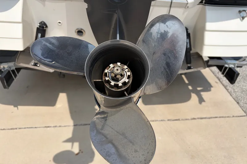 Slide: The Image of Propeller of a 2012 Hurricane SunDeck Sport 220 OB boat on a concrete surface. - 13