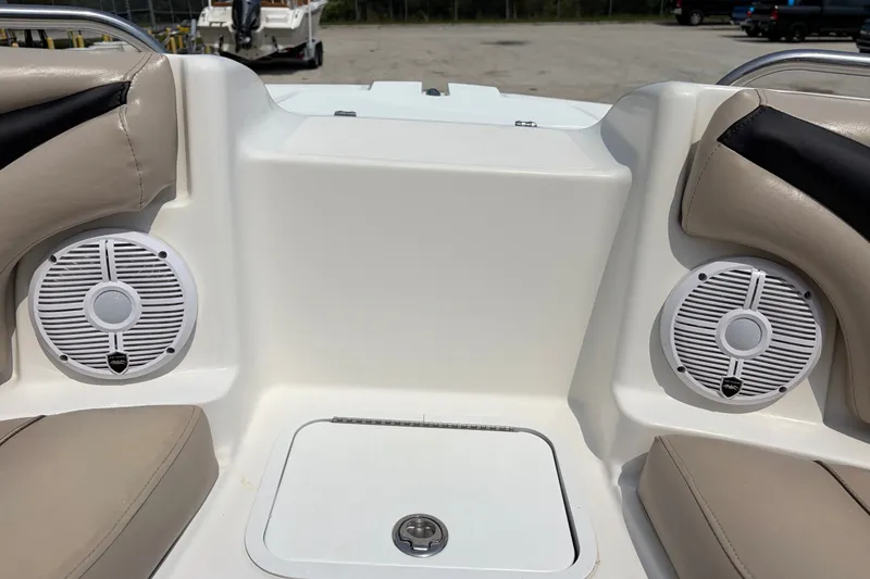 Slide: The Image of Interior of 2012 Hurricane SunDeck Sport 220 OB with speakers and seating. - 40