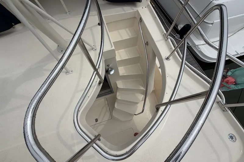 Slide: The Image of Staircase on 2004 Mainship 390 Trawler with sleek metal railings. - 11