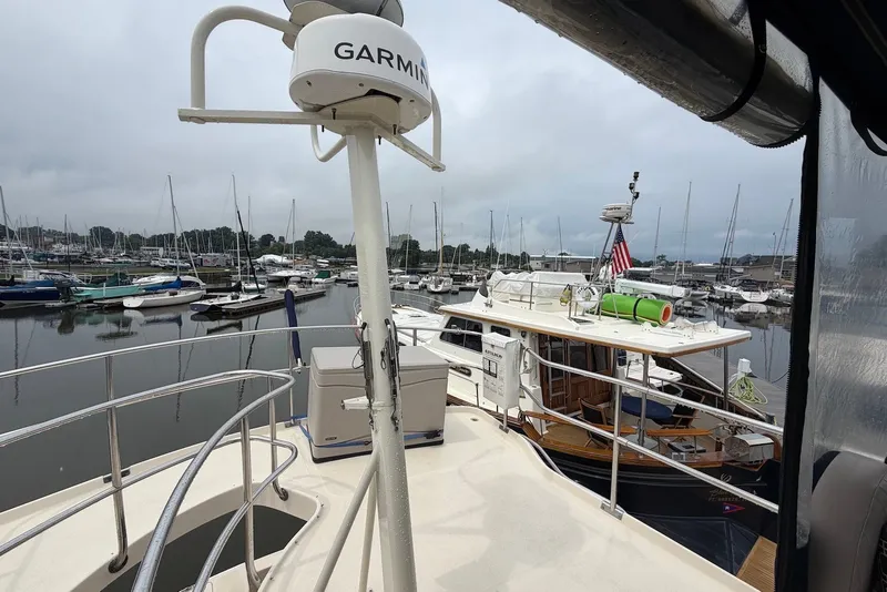 Slide: The Image of 2004 Mainship 390 Trawler docked at marina with Garmin radar. - 9