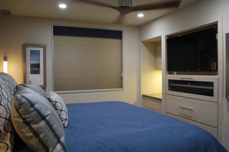Slide: The Image of Modern bedroom with blue bedding, wall-mounted TV, and ambient lighting, Adonia Azul Trip 2017. - 19