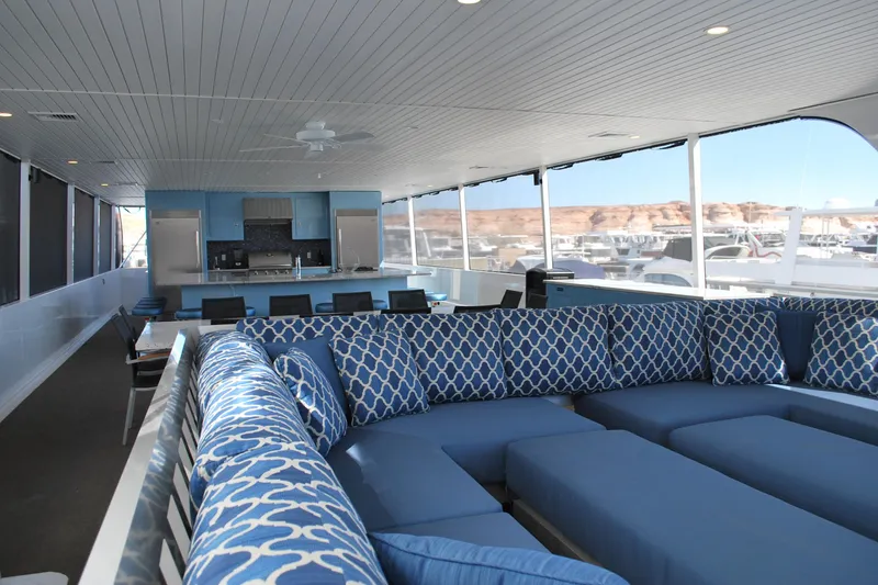 Slide: The Image of Luxurious interior of Adonia Azul Trip #1 houseboat, featuring blue patterned seating and modern kitchen, 2017. - 5