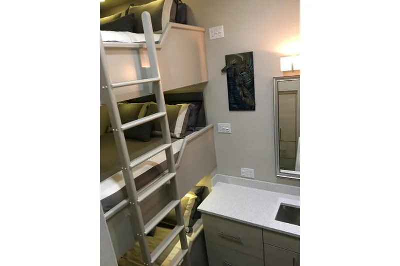 Slide: The Image of Compact bunk bed room with ladder, modern decor, and sleek countertop in Adonia Azul Trip 2017. - 27