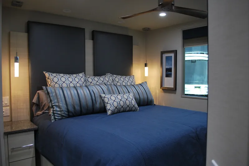 Slide: The Image of Luxurious bedroom interior in Adonia Azul Trip RV, featuring elegant bedding and modern lighting. - 17