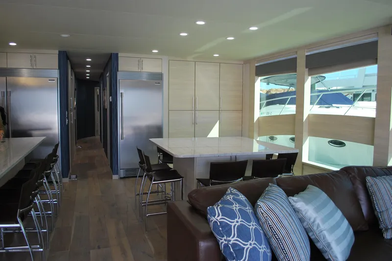 Slide: The Image of Luxurious yacht interior with modern kitchen, dining area, and large windows. Adonia Azul Trip 2017. - 7