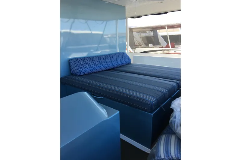 Slide: The Image of Blue interior seating on Adonia Azul Trip #1, 2017, with striped cushions and geometric pillow. - 31