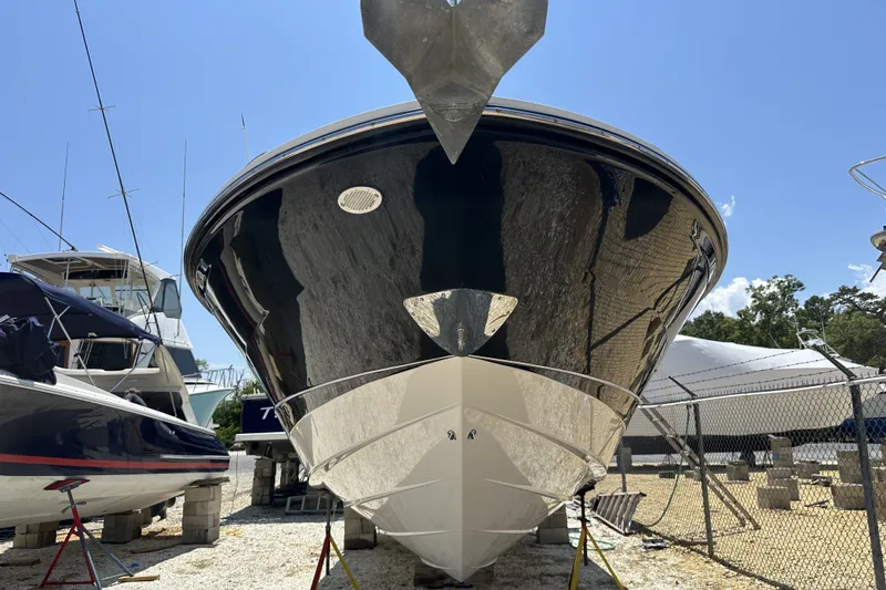 Slide: The Image of 2018 Sea Ray SLX 310 Outboard boat on dry dock, front view, sunny day. - 39