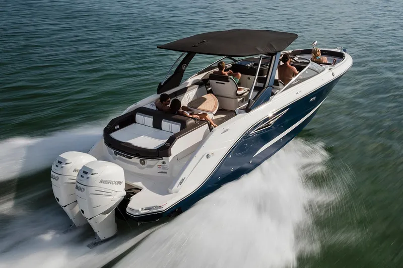 Slide: The Image of Manufacturer Provided Image: 2018 Sea Ray SLX 310 OB cruising on water with twin outboard engines. - 45