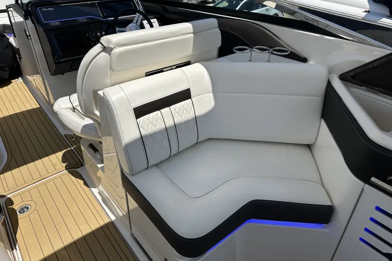 Slide: The Image of Luxurious seating on 2018 Sea Ray SLX 310 Outboard boat with elegant white upholstery. - 11
