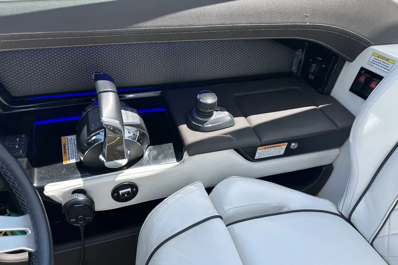 Slide: The Image of Control panel of a 2018 Sea Ray SLX 310 Outboard boat with modern throttle and seating. - 20