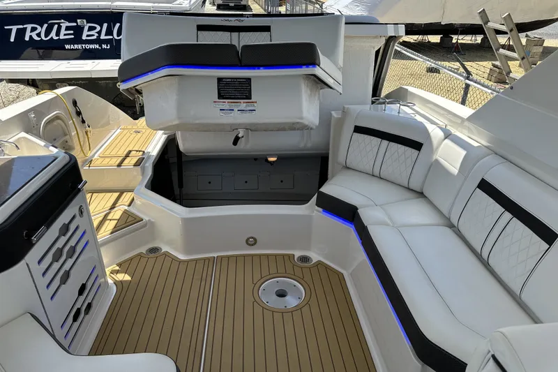 Slide: The Image of Luxurious 2018 Sea Ray SLX 310 Outboard interior with elegant seating and modern design. - 8