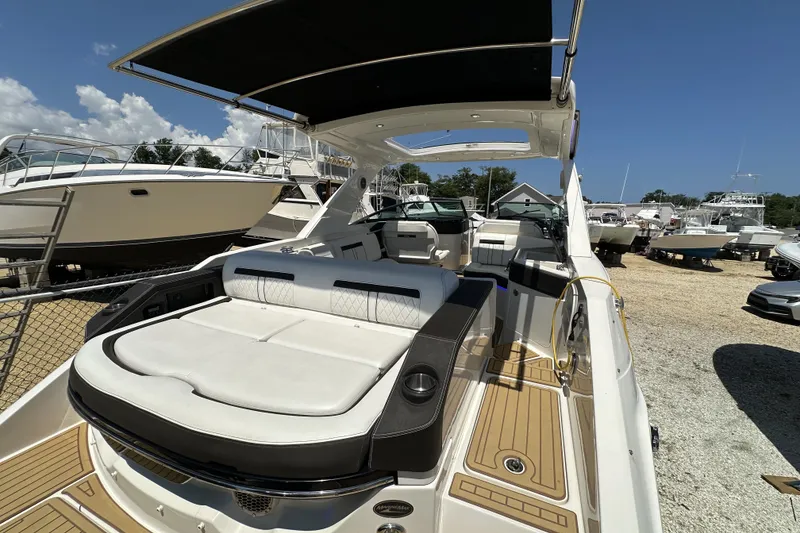 Slide: The Image of 2018 Sea Ray SLX 310 Outboard boat with luxurious seating and sleek design. - 2