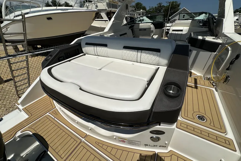 Slide: The Image of 2018 Sea Ray SLX 310 Outboard boat with luxurious seating and modern design. - 26