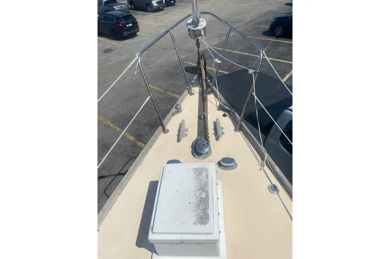 Slide: The Image of Bow view of 1982 Bristol 40 sailboat in a parking lot. - 23