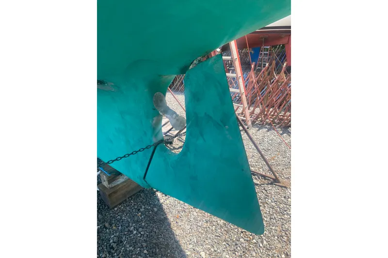 Slide: The Image of Bottom view of a 1982 Bristol 40 sailboat rudder and propeller in a boatyard. - 20