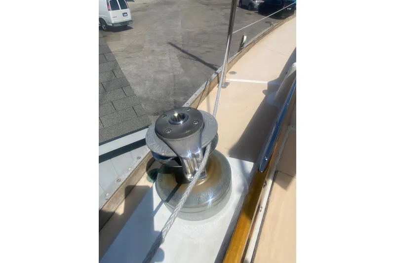 Slide: The Image of Deck view of a 1982 Bristol 40 sailboat featuring a winch and railing. - 14