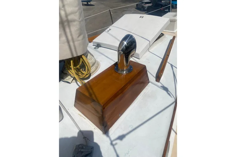 Slide: The Image of Polished chrome vent on 1982 Bristol 40 yacht deck with wooden base. - 17