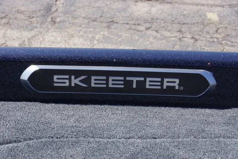 Slide: The Image of 2027 Skeeter FXE21 Limited logo on textured surface, showcasing sleek design. - 29