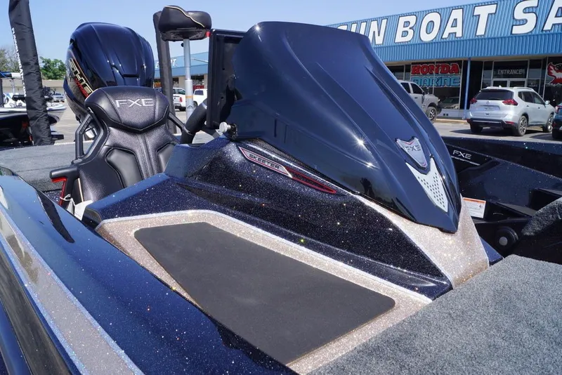 Slide: The Image of 2027 Skeeter FXE21 Limited boat at dealership, showcasing sleek design and premium features. - 22