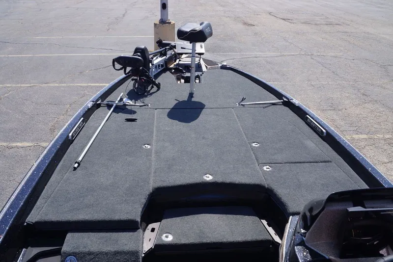 Slide: The Image of 2027 Skeeter FXE21 Limited boat deck with trolling motor and spacious layout. - 28