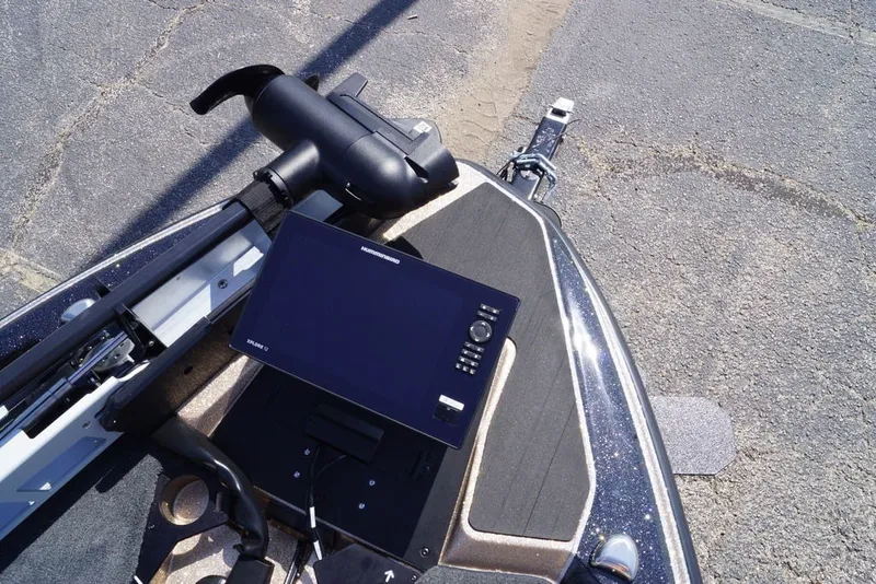 Slide: The Image of 2027 Skeeter FXE21 Limited boat with advanced navigation system on deck. - 27