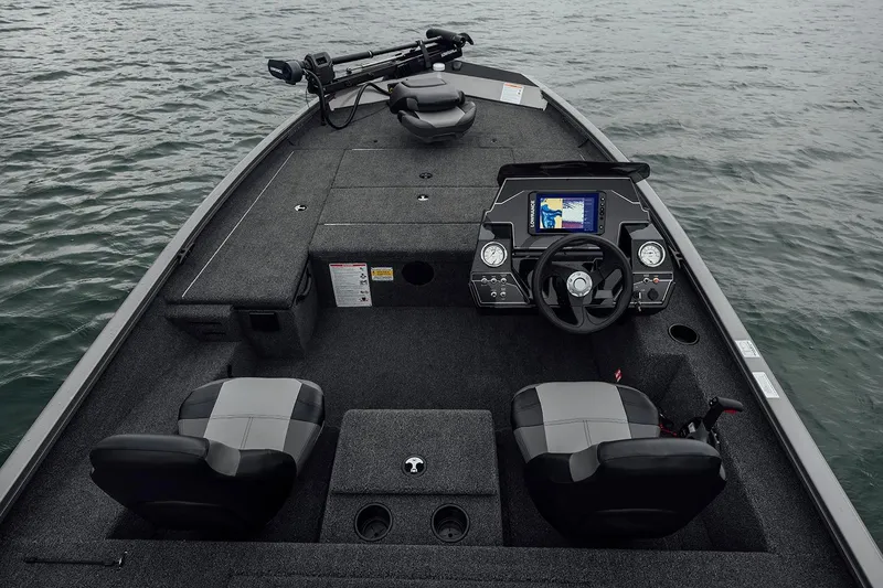 Slide: The Image of Manufacturer Provided Image: 2026 Crestliner XFC 179 boat interior with steering console and seating on water. - 13