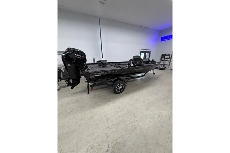 Slide: The Image of 2026 Crestliner XFC 179 fishing boat with Mercury engine in showroom. - 2