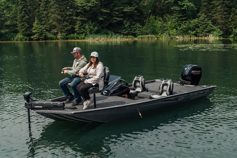 Slide: The Image of Manufacturer Provided Image: Two people fishing on a 2026 Crestliner XFC 179 boat in a serene lake. - 11