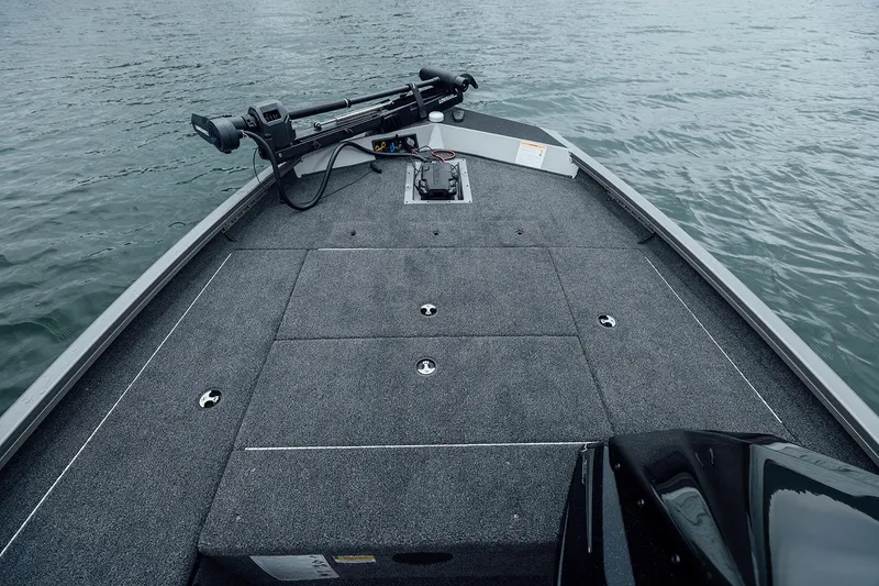 Slide: The Image of Manufacturer Provided Image: 2026 Crestliner XFC 179 boat deck on water, featuring fishing equipment. - 12