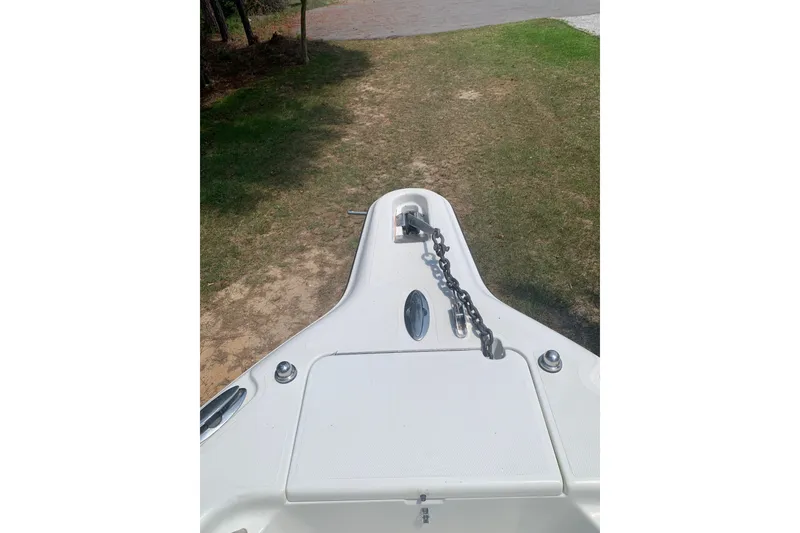 Slide: The Image of Bow view of 2005 Triton 2895 CC boat with anchor chain on deck. - 17