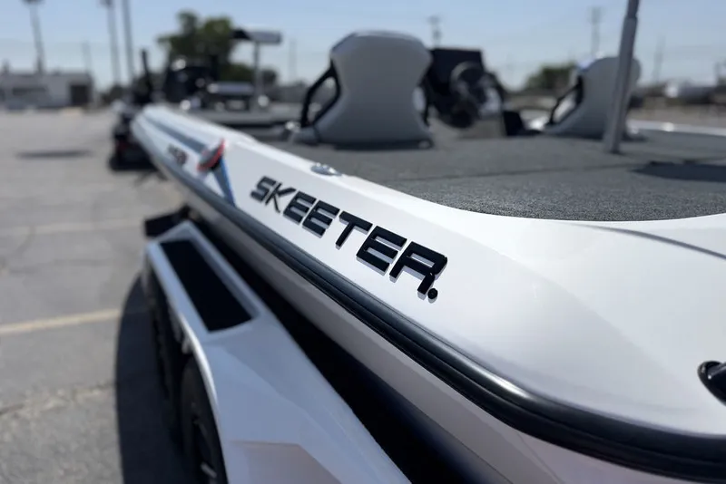 Slide: The Image of 2027 Skeeter FXE20 Limited boat, sleek design, close-up view, outdoor setting. - 7