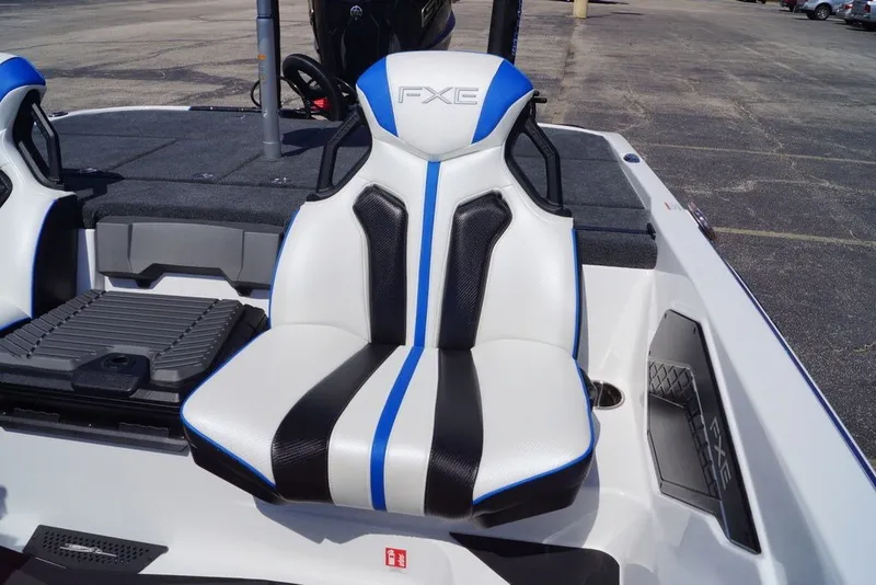 Slide: The Image of 2027 Skeeter FXE20 Limited boat seat with blue and black accents. - 11