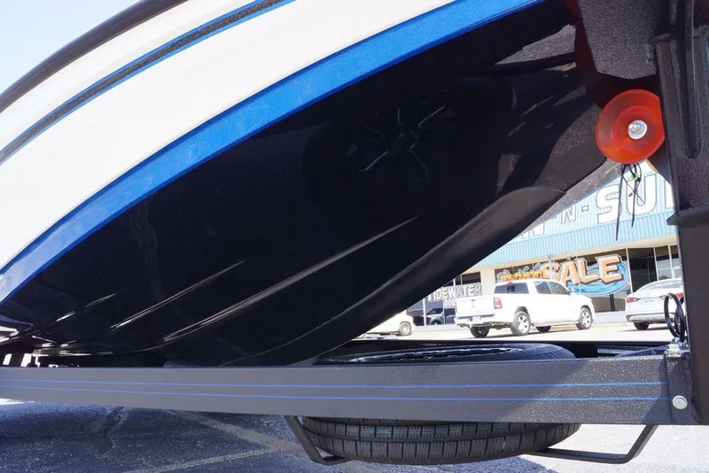 Slide: The Image of 2027 Skeeter FXE20 Limited boat hull on trailer, showcasing sleek design and vibrant colors. - 4