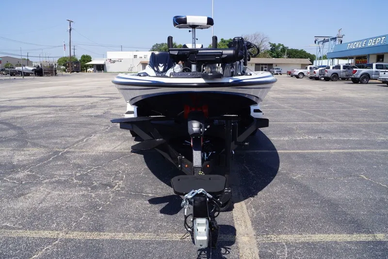 Slide: The Image of 2027 Skeeter FXE20 Limited boat on trailer in parking lot. - 5