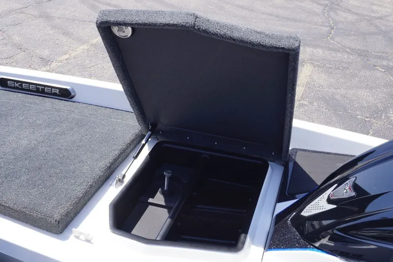Slide: The Image of Open storage compartment on 2027 Skeeter FXE20 Limited boat deck. - 28