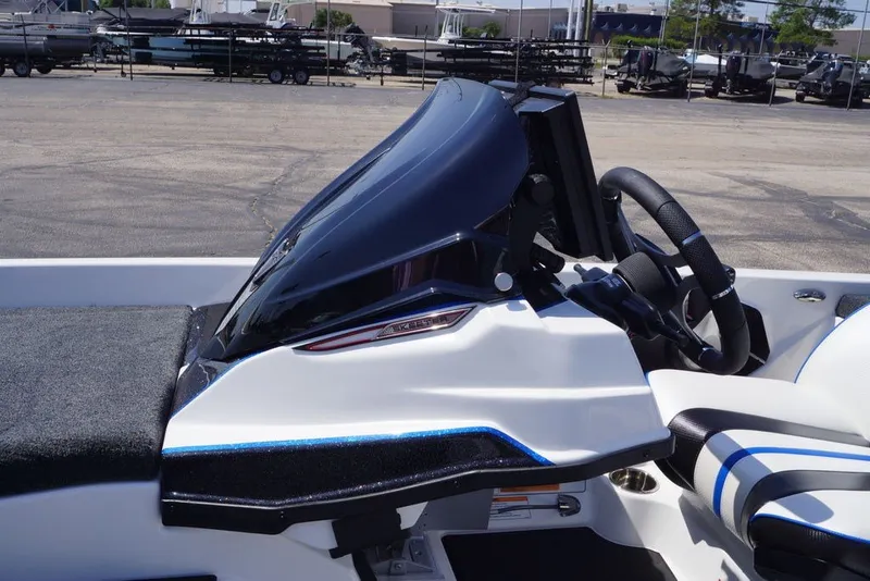 Slide: The Image of 2027 Skeeter FXE20 Limited boat dashboard with steering wheel and controls. - 13