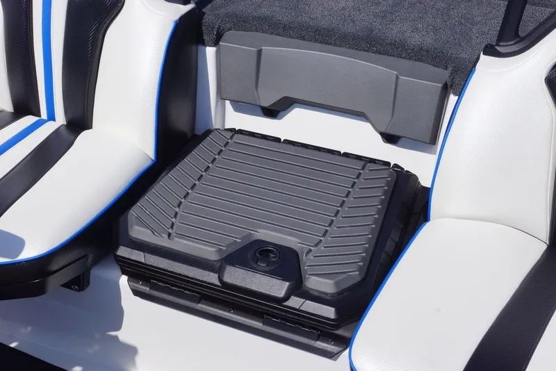 Slide: The Image of 2027 Skeeter FXE20 Limited boat seating with storage compartment, featuring black and blue accents. - 20